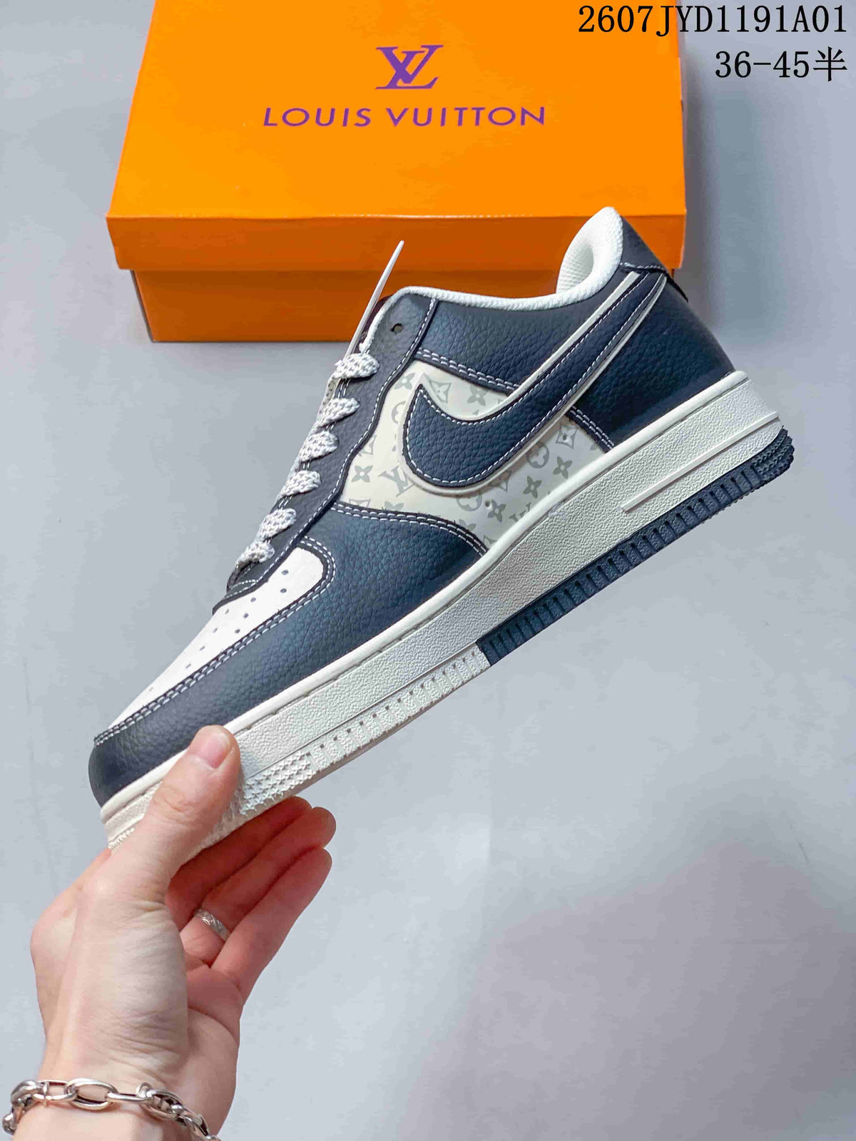 Side profile showing navy overlays, patterned panels, and a white midsole