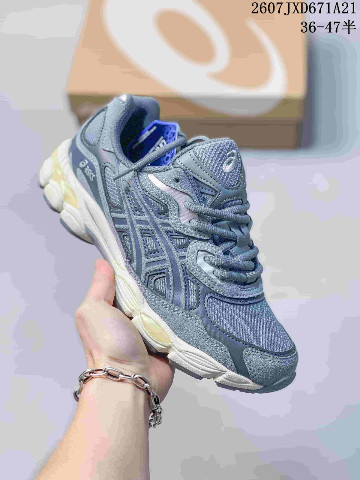 Blue-gray ASICS GEL-Kayano 14 sneaker with a light segmented sole.