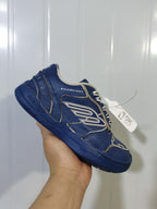 Close angled view of the Balenciaga 4090 sneaker showing the side branding, contrasting trim, and textured outsole.