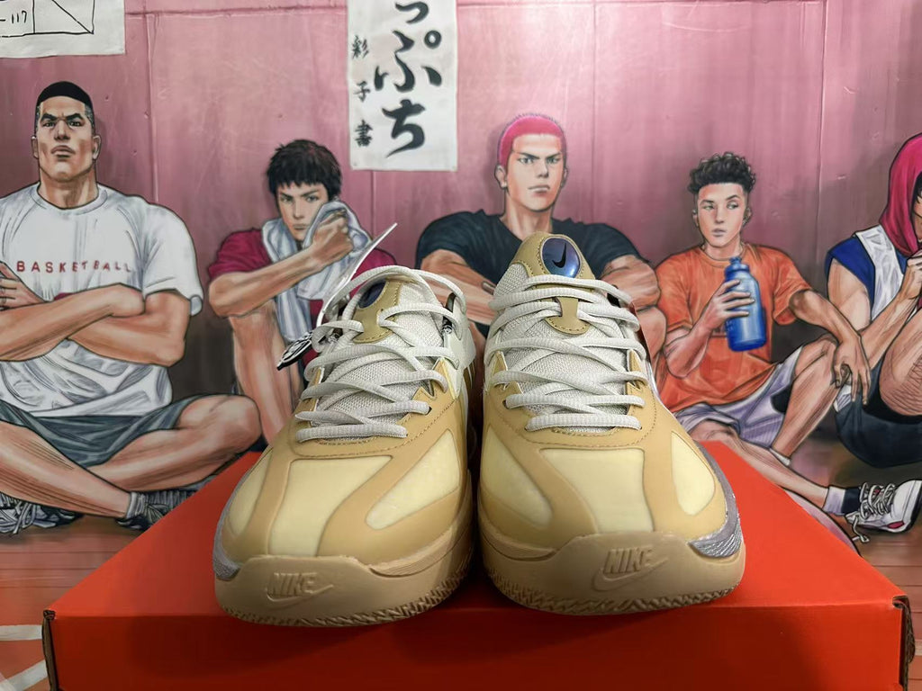 Front view of white and yellow Nike basketball shoes with lace-up closure