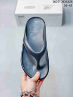 Top view of the black flip-flop sandal showing the textured footbed and thong-style upper.
