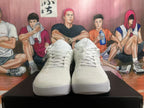 Front view showing the laces and knit-textured upper of white basketball shoes