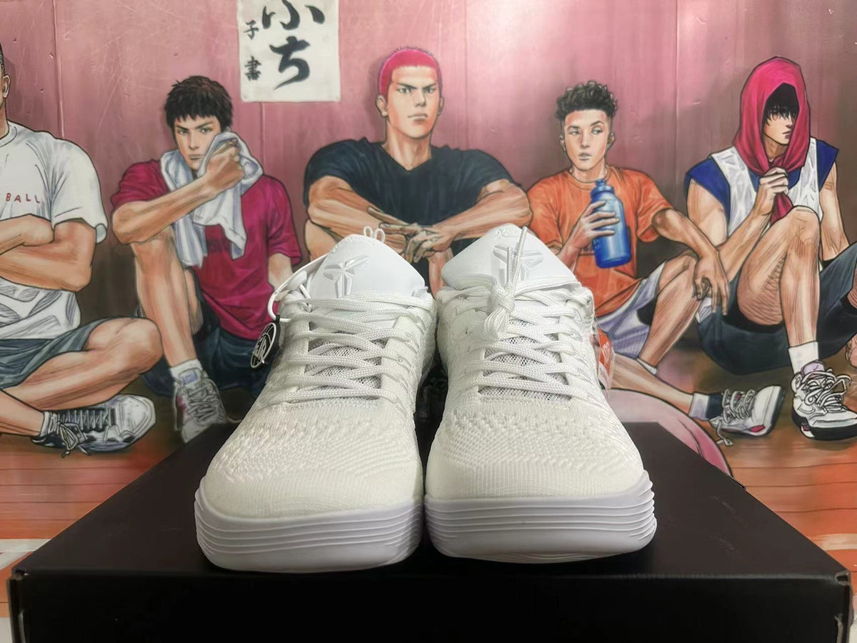 Front view showing the laces and knit-textured upper of white basketball shoes