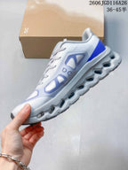 Side view of a white sneaker with blue and lavender panels and a sculpted sole; image text states sizes 36–45½