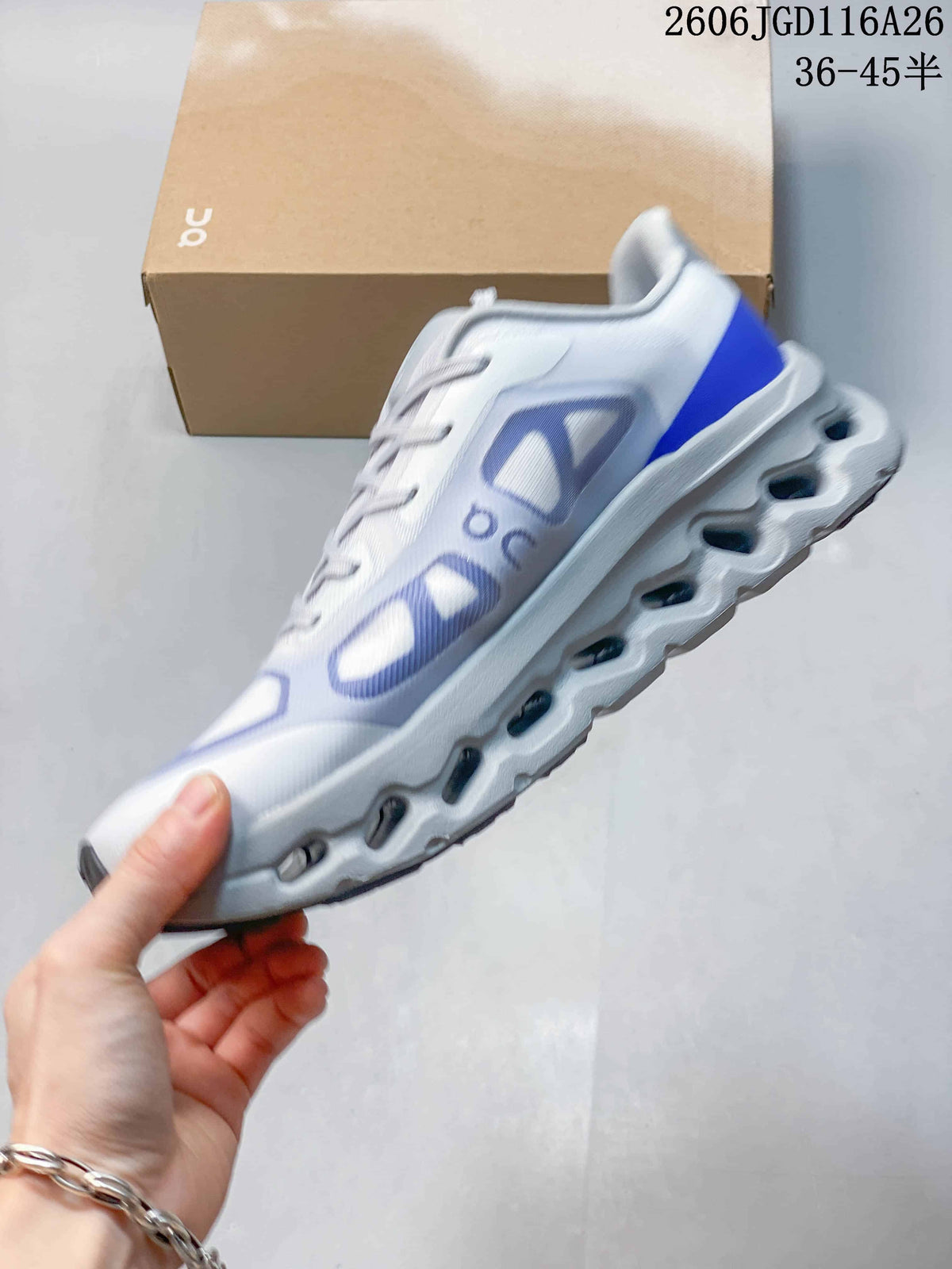 Side view of a white sneaker with blue and lavender panels and a sculpted sole; image text states sizes 36–45½
