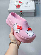 Pink Hello Kitty platform mule clog shown close up from the side.