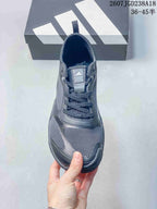Top view of the sneaker showing the lace-up closure, tongue branding, and textured toe area.