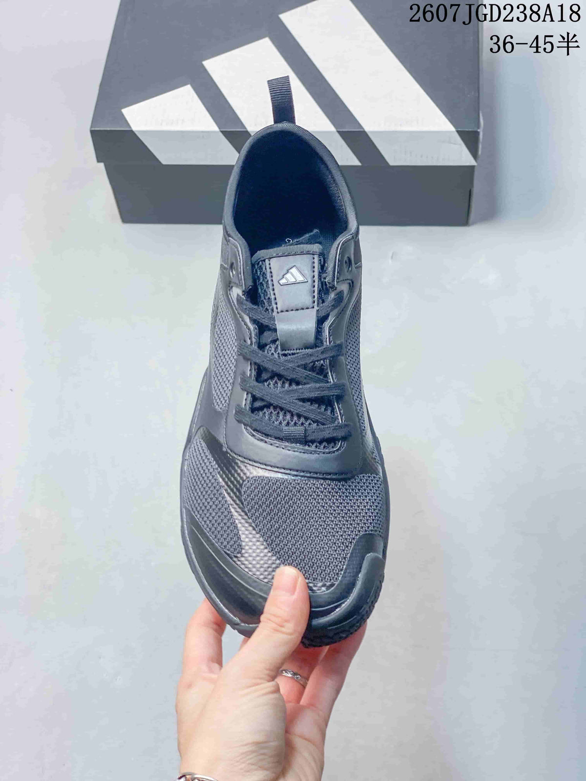 Top view of the sneaker showing the lace-up closure, tongue branding, and textured toe area.
