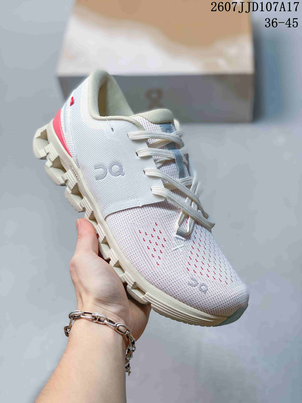 Angled side view of the white On Cloud X 4 AD sneaker showing the On logo, lace-up design, red heel accent and segmented outsole.