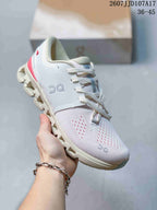 Angled side view of the white On Cloud X 4 AD sneaker showing the On logo, lace-up design, red heel accent and segmented outsole.