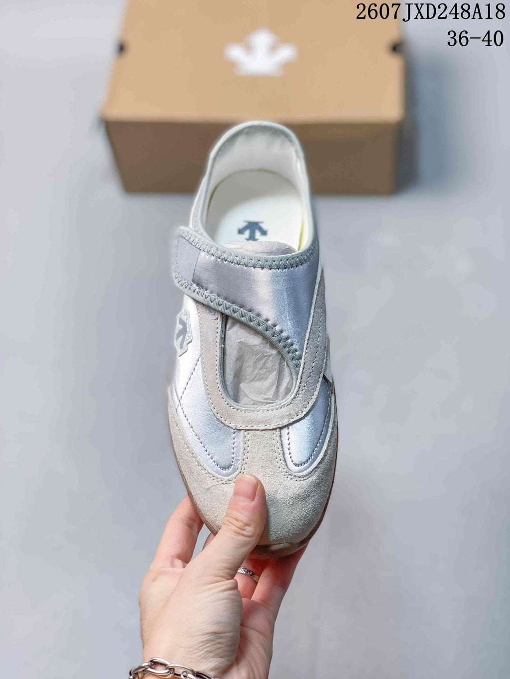 Top view showing the rounded toe, broad strap, and layered panel design.
