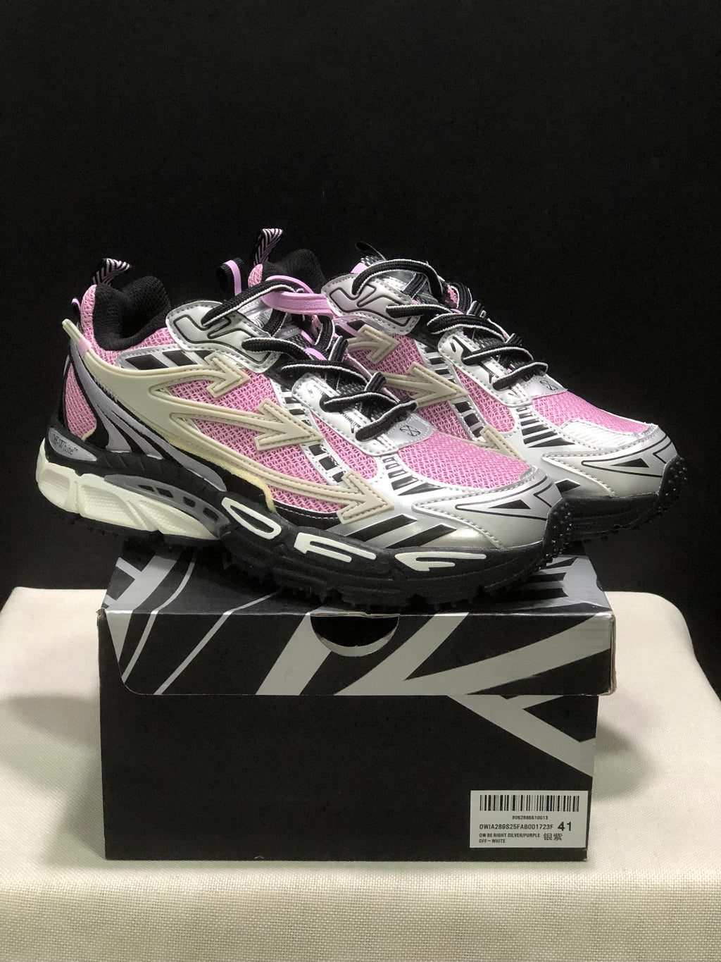 The sneakers displayed on a branded box; the visible box label shows size 41 and the text “BE RIGHT BACK.”