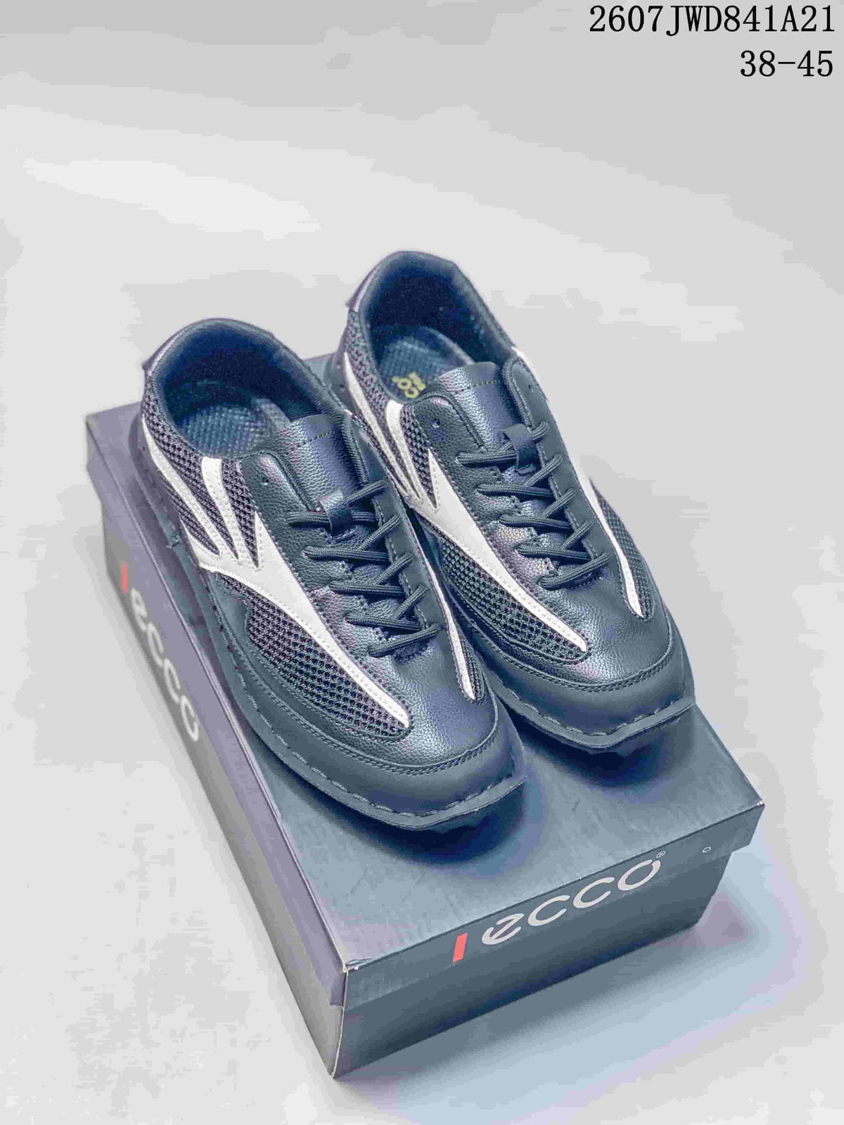 Pair of black and white ECCO sneakers displayed on a branded shoebox; style code 2607JWD841A21 and size range 38–45 are visible.