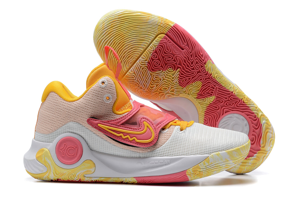 White and blush Nike KD basketball shoes with yellow and coral accents.