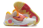White and blush Nike KD basketball shoes with yellow and coral accents.