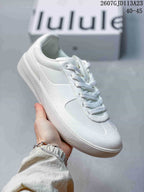 Side view of a white lululemon Cityverse sneaker showing the padded collar, tonal upper panels, and white rubber outsole; image text shows style code 2607GJD113A23 and size range 40–45.