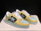 Front three-quarter view of the BAPE STA sneakers highlighting the perforated toe panels and star-shaped side details.
