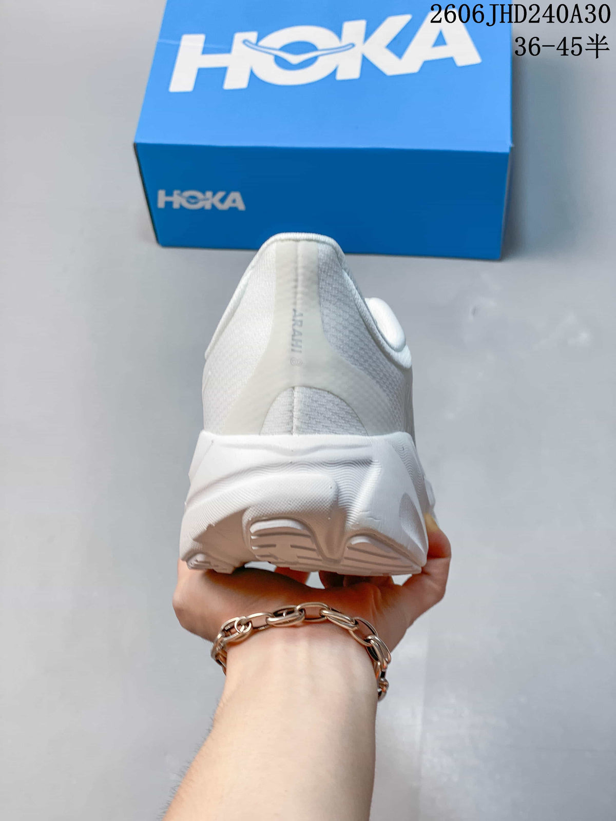 Heel view of the white HOKA Arahi 8 shoe