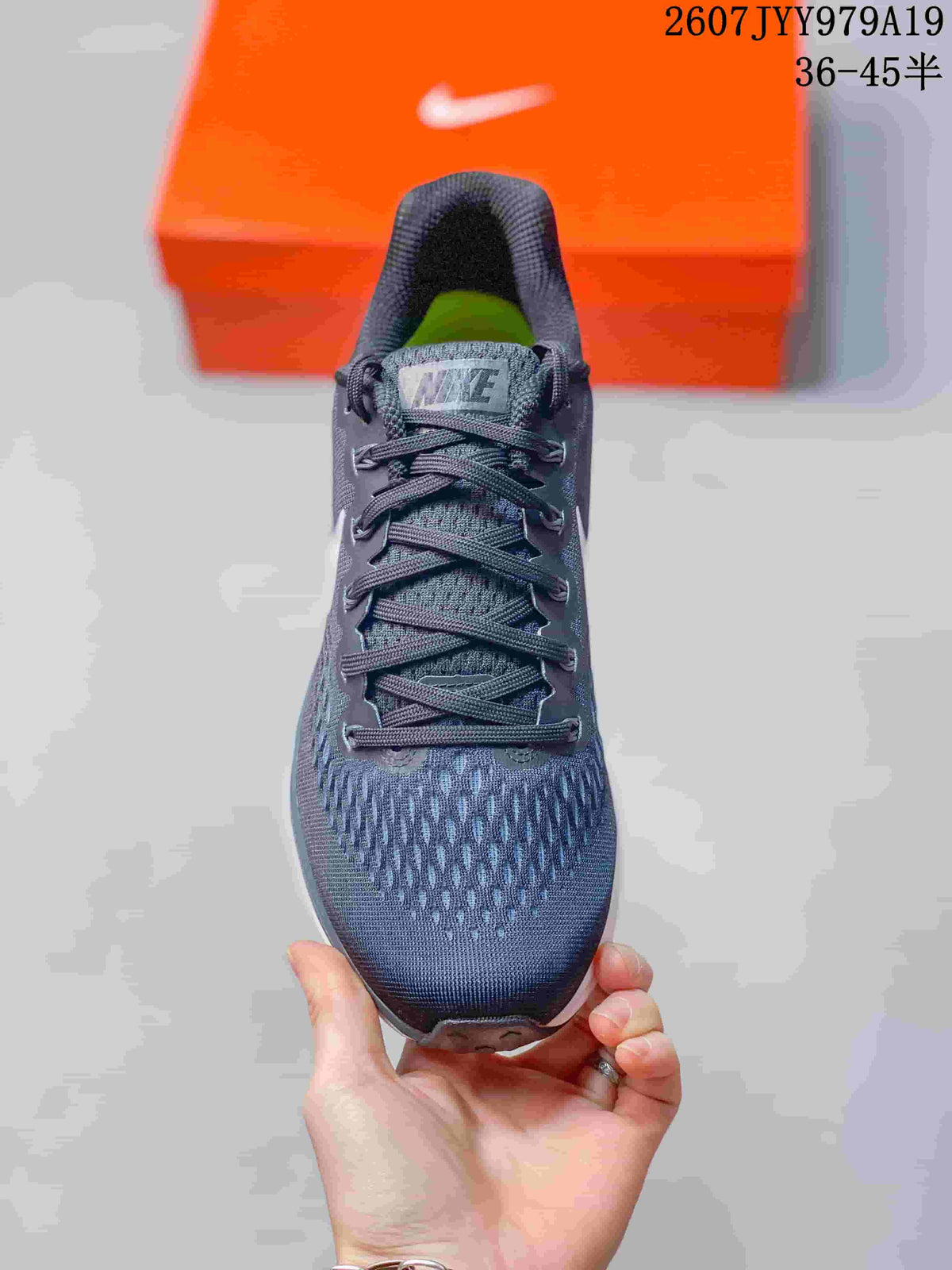 Top view showing the dark mesh toe box, laces, padded tongue and bright green insole area.
