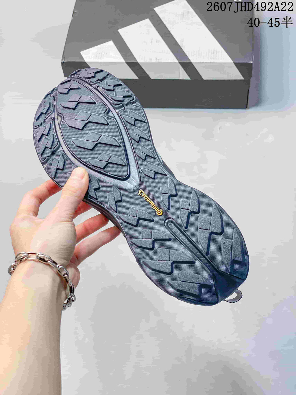 Close view of the hiking shoe outsole showing a deep lug pattern and Continental branding.