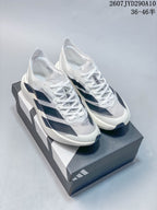 Pair of white and dark navy Adidas Adizero Adios Pro Evo2 running shoes displayed on a shoebox.