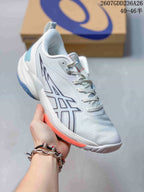 Close side view of a white ASICS Swiftace basketball shoe with blue and orange outsole accents.
