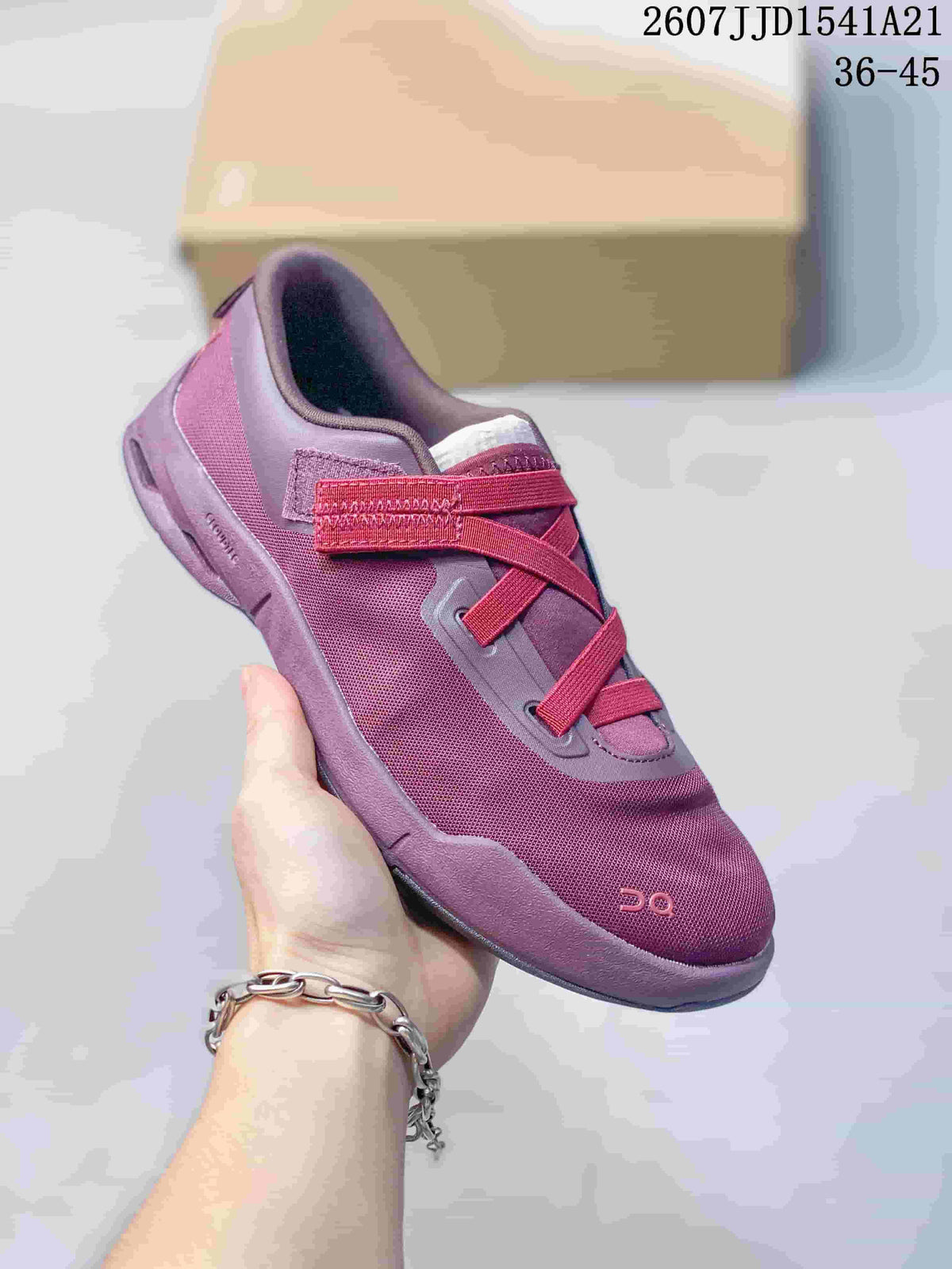 Angled view of a purple and red On Cloudnova sneaker showing the mesh-like upper, strap closure, and cushioned sole.