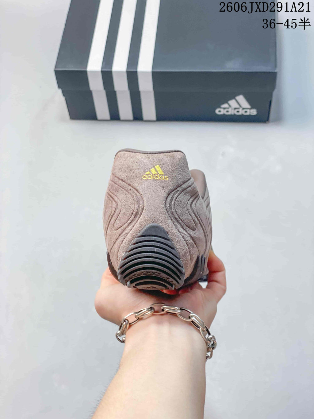 Rear view showing the padded heel, adidas logo and black outsole sections.