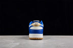 Rear view of the sneaker showing blue and white heel panels with a gold accent and Nike branding.