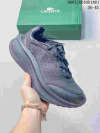 Dark gray Lacoste lace-up sneaker with patterned upper and green shoebox