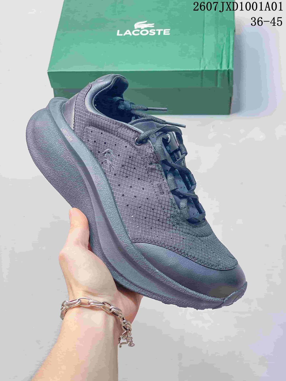 Dark gray Lacoste lace-up sneaker with patterned upper and green shoebox