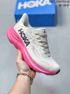 Angled side view of a white HOKA Clifton 10 sneaker with black side branding and a bright pink sculpted sole; image text shows size range 36–40.5.