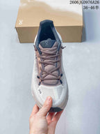 Top view of the sneaker showing its laces, tongue, and white upper.
