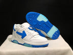 Angled view showing the blue outsole tread and translucent sections beneath the white sneaker.