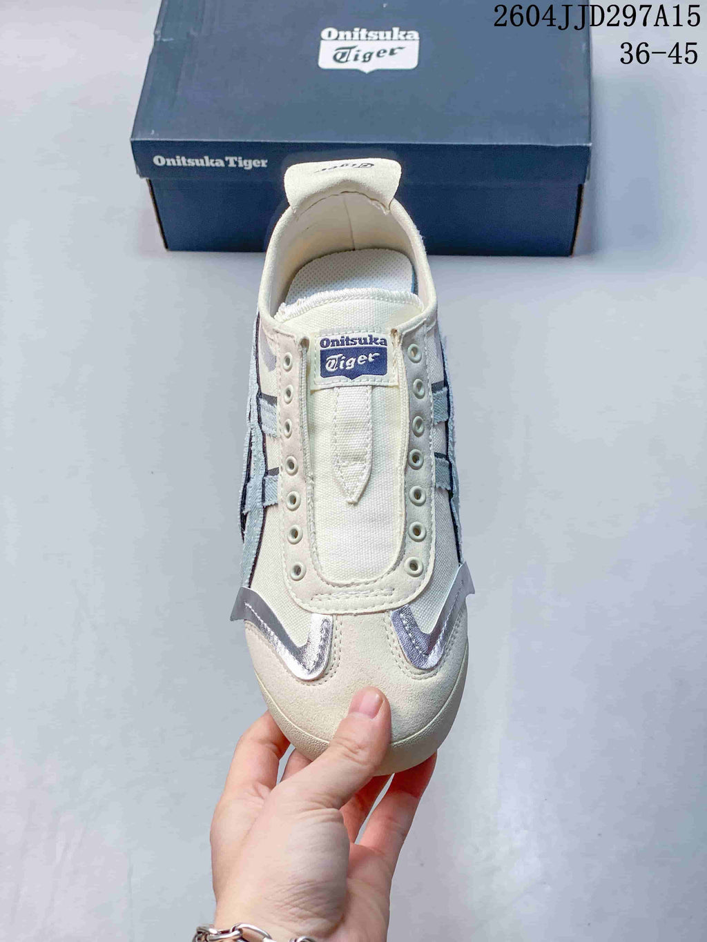 Top view showing the cream toe, open slip-on tongue area, eyelet rows, and pale blue detailing.