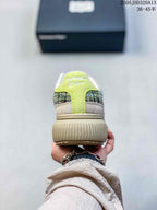 Rear view of the sneaker with a bright yellow-green heel panel
