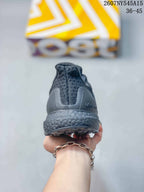 Rear view of the dark gray sneaker showing the padded heel collar, heel counter, textured midsole, and outsole edge.