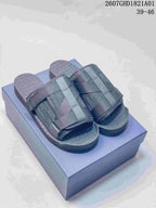 Pair of dark grey open-toe sandals with woven patterned uppers and textured footbeds; image shows size range 39–46.