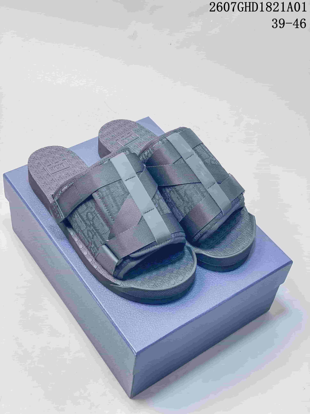 Pair of dark grey open-toe sandals with woven patterned uppers and textured footbeds; image shows size range 39–46.