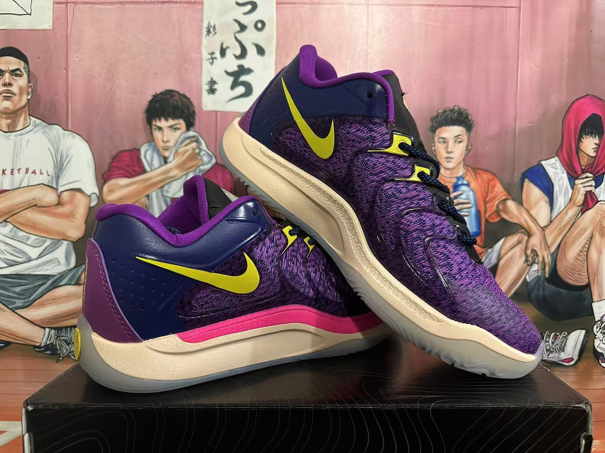 Pair of purple and navy Nike basketball shoes shown from the side, with yellow Swooshes and cream-colored soles.