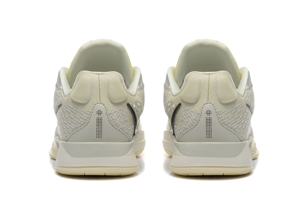 Rear view of pale yellow and light gray Nike Kobe 5 Protro shoes