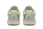 Rear view of pale yellow and light gray Nike Kobe 5 Protro shoes
