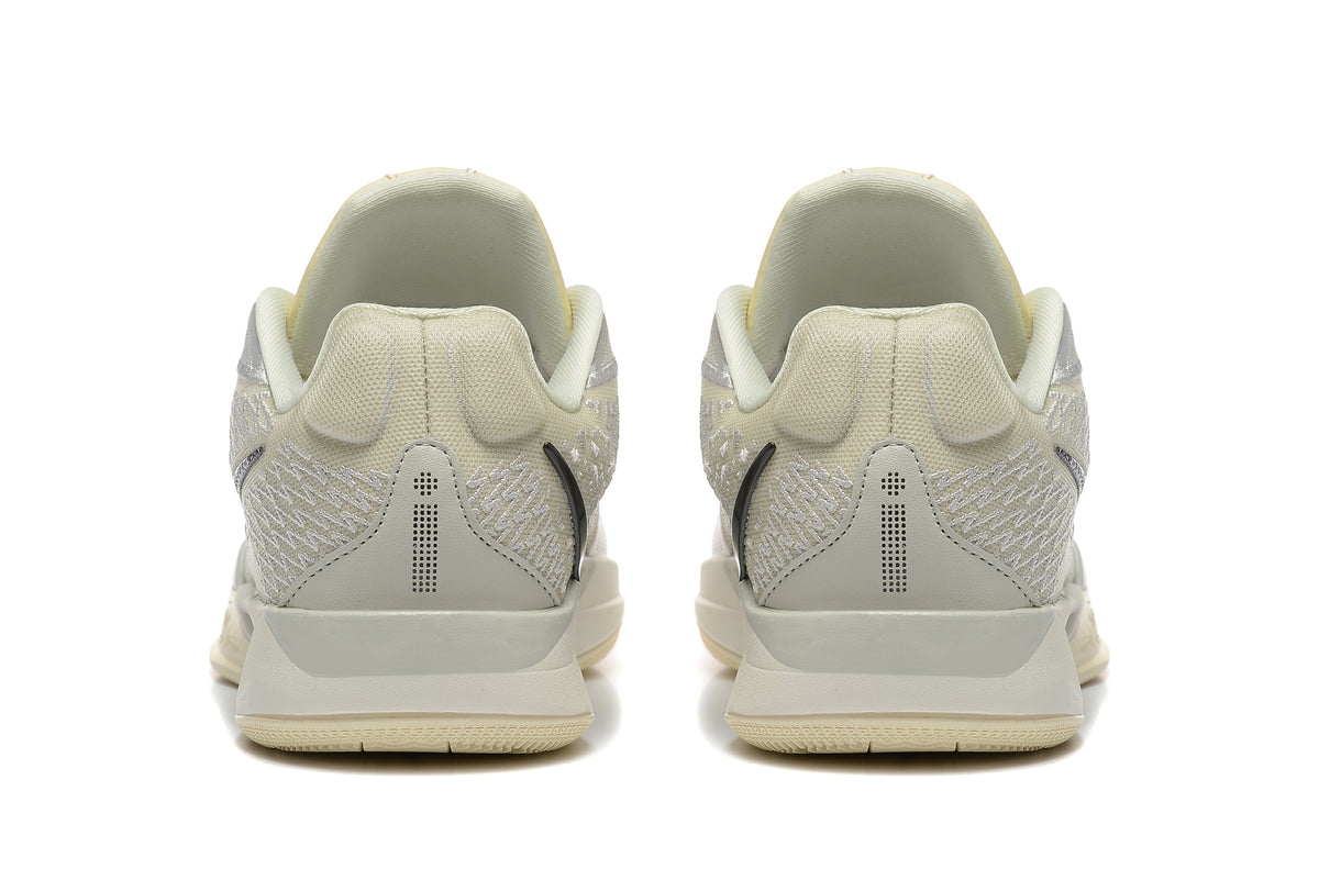 Rear view of pale yellow and light gray Nike Kobe 5 Protro shoes