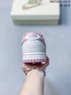 Rear view showing the white heel, pink outsole edge, stitched panels, and Nike branding; image text shows style code 2607GDD115A15 and size range 35–45.