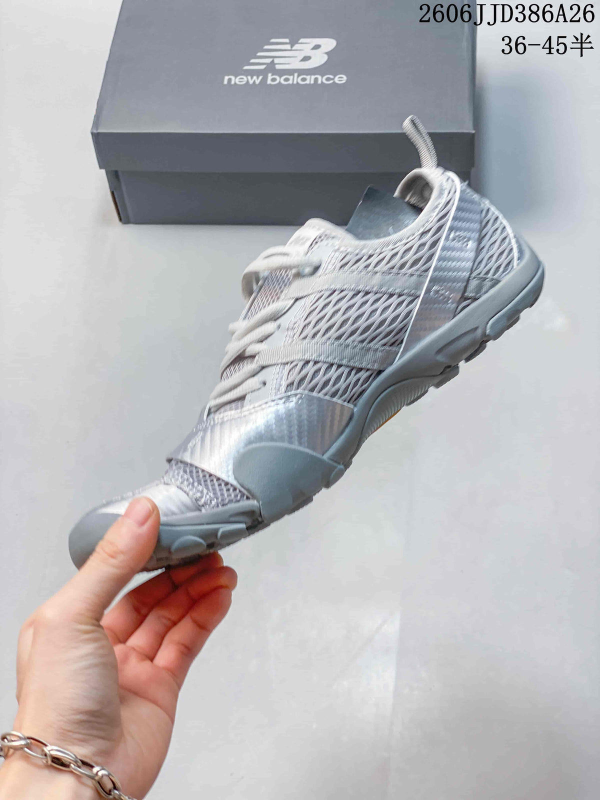 Side profile showing the layered mesh-style upper, lace-up closure, and low-top silhouette.