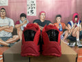 Rear view of red and black Nike basketball shoes with glossy black heel details