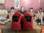 Rear view of red and black Nike basketball shoes with glossy black heel details