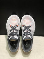 Top-down view showing the textured uppers, dark laces, orange lace details, and insoles marked Cloud X.