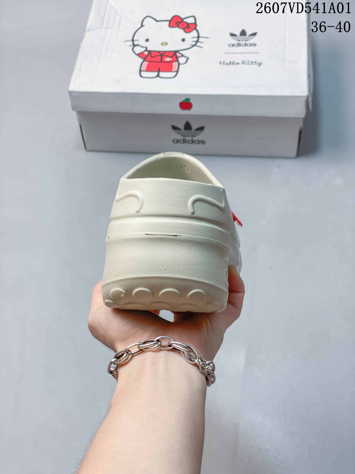 Rear view of a cream mule clog with a raised sole