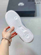 White textured outsole of the metallic silver sneaker, showing concentric circular traction details and Nike branding; overlay text shows size range 36–45.
